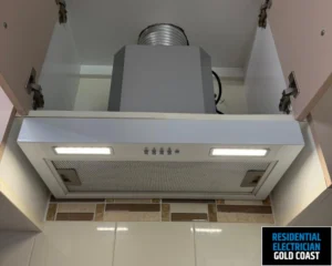 A kitchen range hood with integrated lighting and modern design.