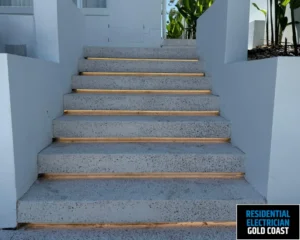 Staircase with illuminated steps for added visibility.